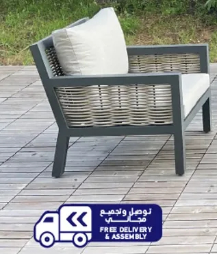 A stylish outdoor chair with a comfortable cushion.