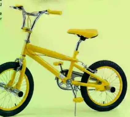 A bright yellow bicycle designed for kids, featuring a sturdy frame and comfortable seat.
