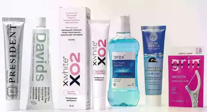 Various oral care products including toothpaste and mouthwash.