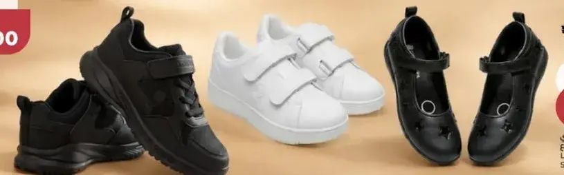 Assorted kids' shoes in black and white.